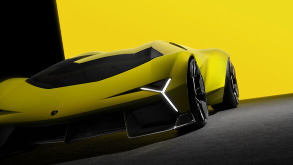 Обои на рабочий стол Желтый Ламборгини / Lamborghini с включенными фарами, на фоне желтой и черной стены