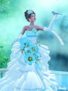 Фото Девушка в платье с синими цветами держит на руке птицу