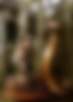 Фото Обнаженная девушка стоит в плетенной корзине, рядом парень-джин с изображением половины тела в виде змеи, играет на флейте, фото-арт дуэта DDiArte