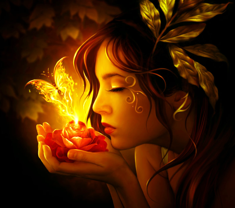 Фото Девушка держит в руках цветок с огненной бабочкой