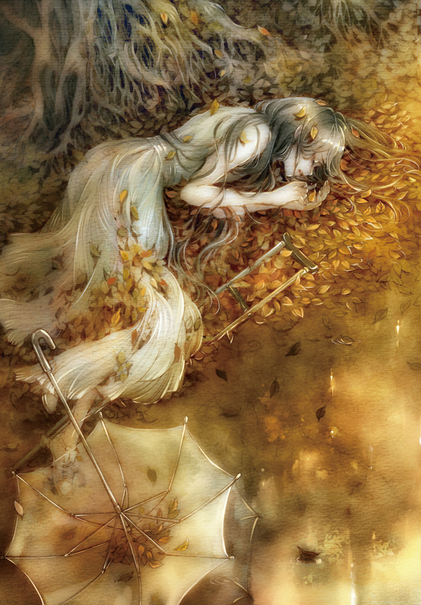 Фото Девушка лежит в осенней листве