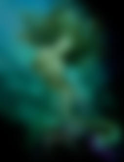 Фото Русалка плавает под водой недалеко от развалин