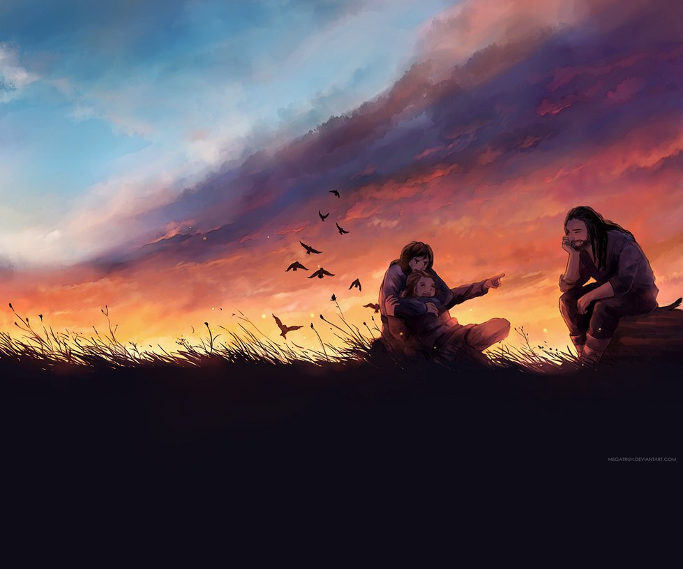 Фото Компания друзей сидит в поле на фоне закатного неба