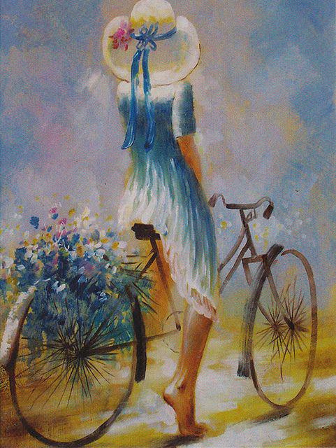 Фото Девушка на велосипеде с цветами