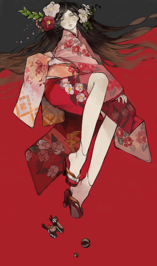 Фото Девушка, одетая в кимоно, с цветами в волосах