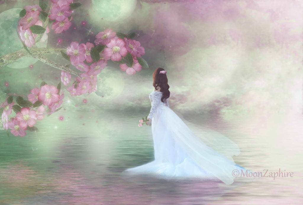 Фото Девушка в белом платье и с цветами в руке стоит в воде, около веток с цветами, Moon Zapire