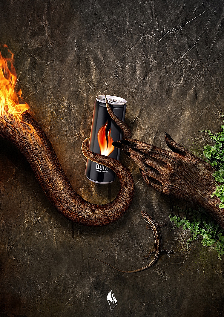 Фото Реклама энергетического зажигающего напитка Берн / Burn/, горящий корень дерева держит банку напитка, к которому тянется рука с дерева