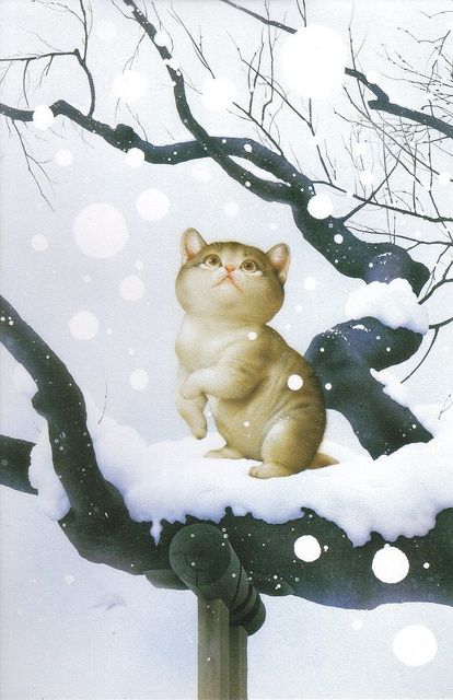 Фото Котенок сидит на дереве и смотрит на падающий снег