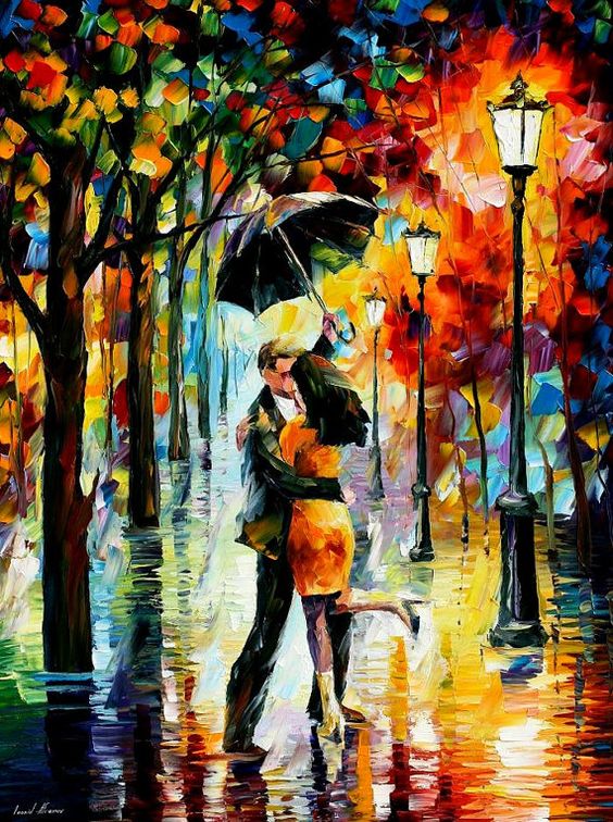 Фото Мужчина с девушкой целуются под зонтом, стоя во время дождя
