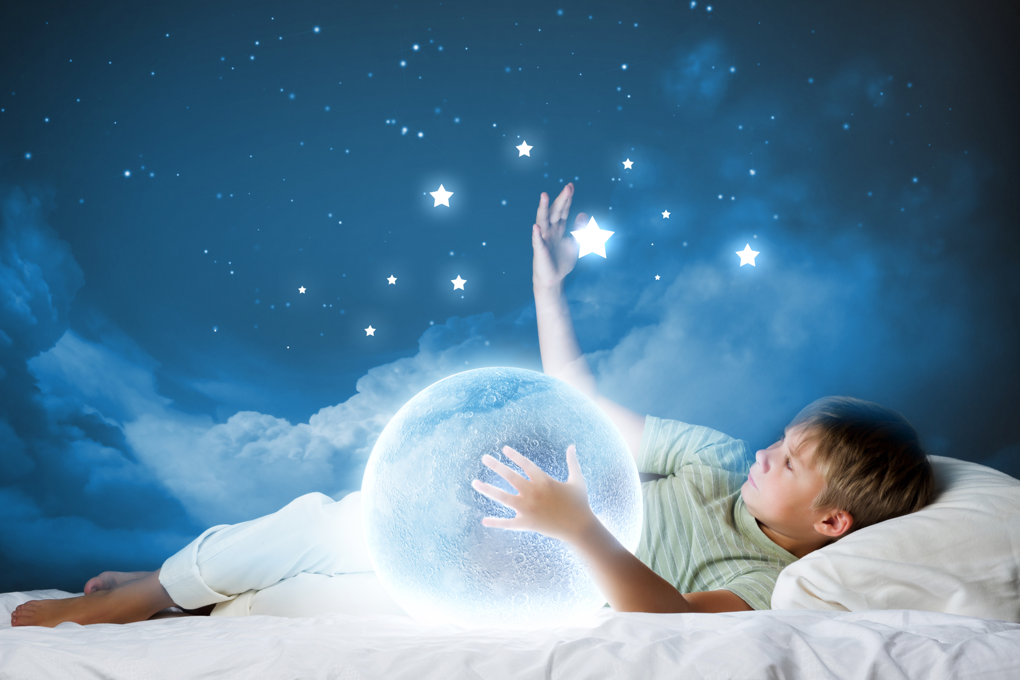 Фото Мальчик лежит среди облаков, обнимает планету и трогает звезды, by Adfave