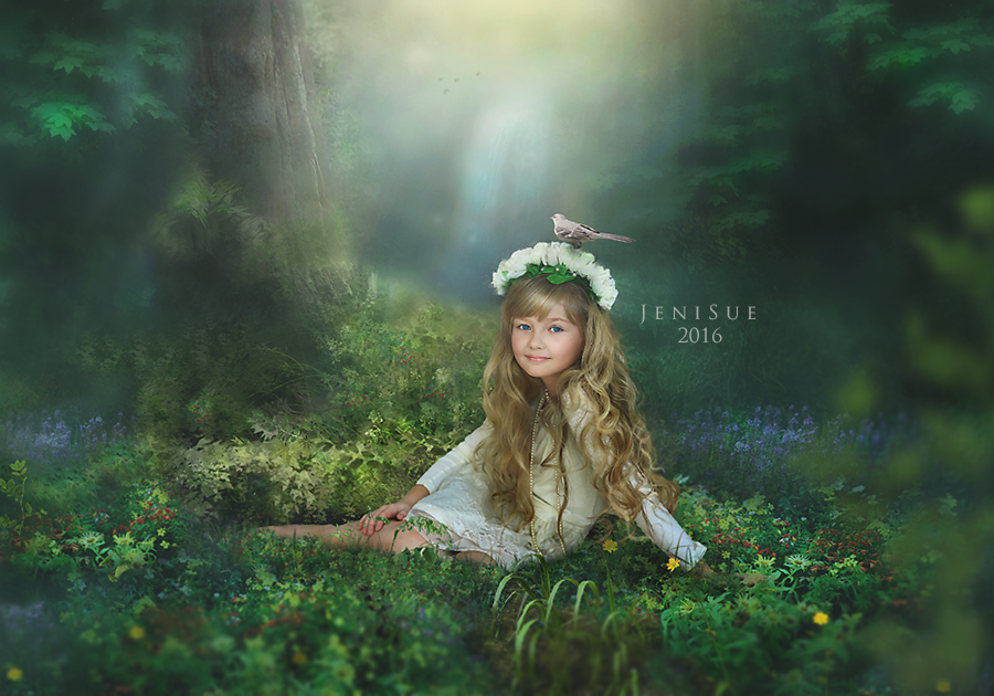 Фото Красивая девочка с венком на голове из цветов и с птичкой на голове сидит на фоне леса, by Jeni-Sue