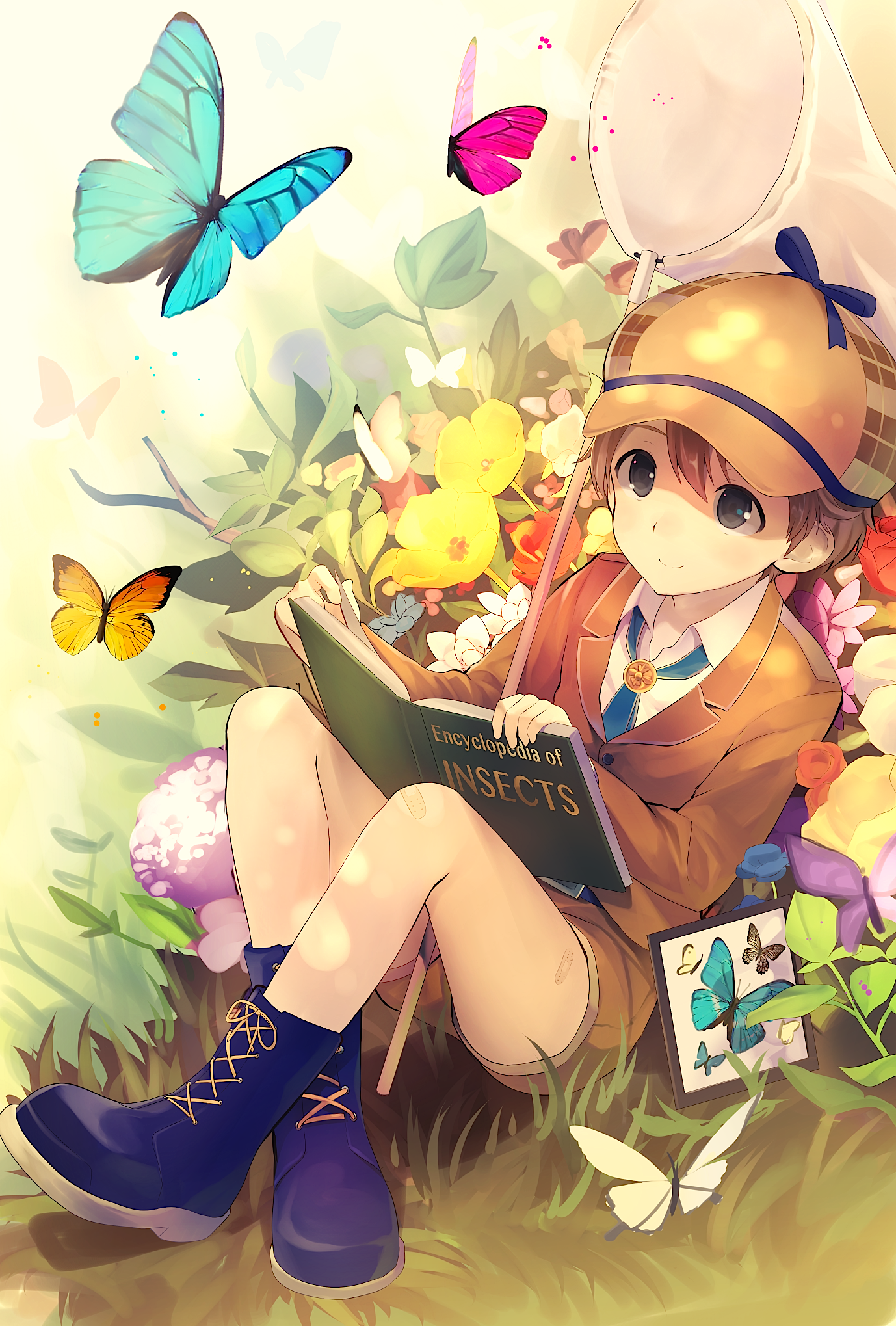 Фото Мальчик с книгой в окружении бабочек