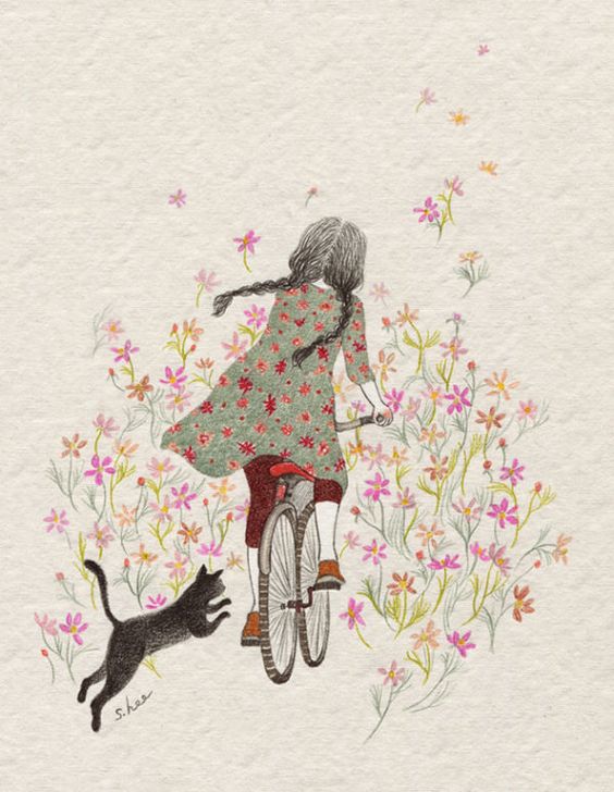 Фото Девочка едет на велосипеде и за ней бежит кот