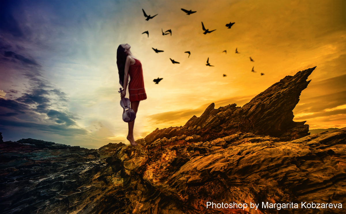 Фото Девушка в руках со скрипкой, запрокинув голову назад стоит на скале, на фоне закатного неба, облаков и летящих птиц, фотоманипуляция Маргариты Кобзаревой