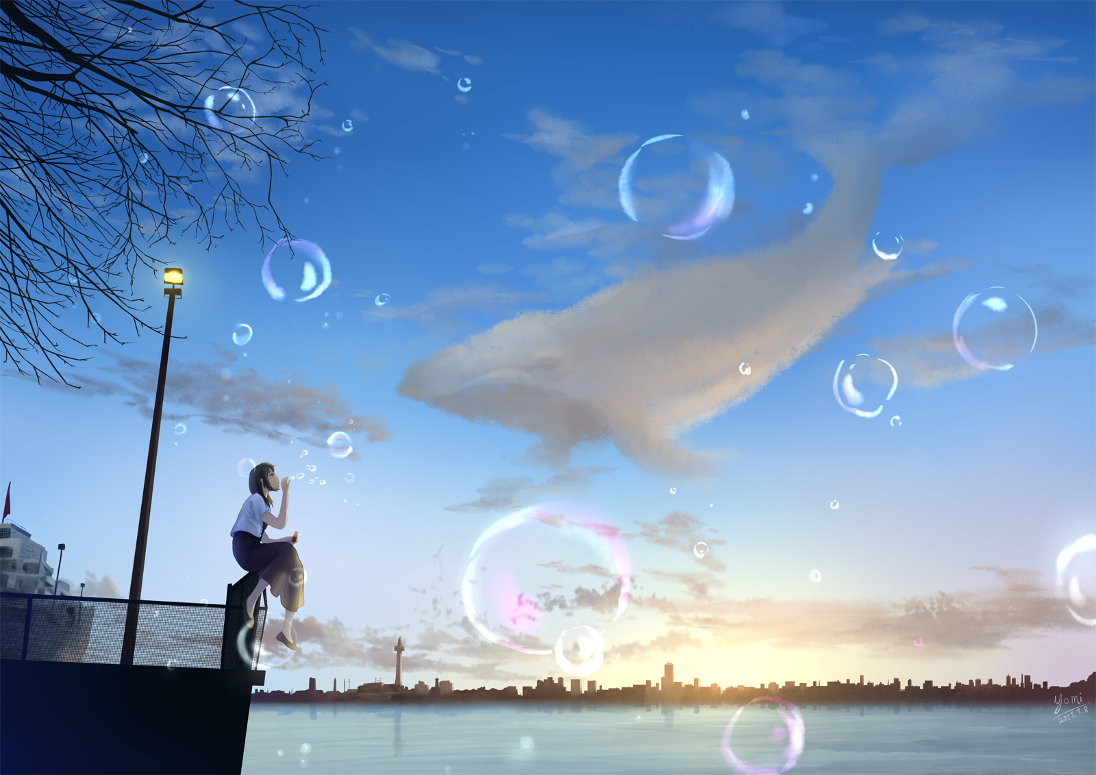 Фото Девушка сидит на заборе и пускает мыльные пузыри