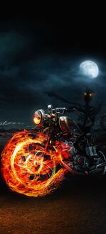 Фото Призрачный гонщик / Ghost Rider с огненными эффектами едет на фоне ночного лунного неба