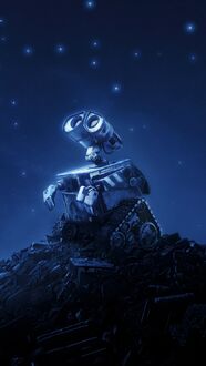 Фото Робот ВАЛЛ·И / WALL-E, стоя на горе с мусором, мечтает завести друзей