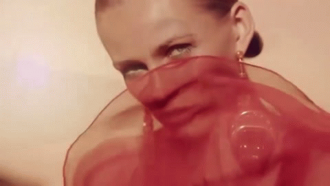 Анимация Модель Edita Vilkeviciute / Эдита Вилкевичуте с прозрачной красной легкой развевающейся накидкой скользящей по лицу и с крупными серьгами в ушах, гифка Модель Edita Vilkeviciute / Эдита Вилкевичуте с прозрачной красной легкой развевающейся накидкой скользящей по лицу и с крупными серьгами в ушах