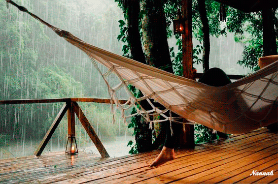Анимация Девушка лежит на гамаке и смотрит на дождь, by Nannah, гифка Девушка лежит на гамаке и смотрит на дождь, by Nannah