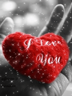 Анимация Игрушечное сердце в руке под снегом переливается цветами (I love you), гифка Игрушечное сердце в руке под снегом переливается цветами (I love you)