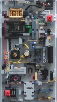 Обои на телефон Прибор из конструктора LEGO черного и желтого цвета на сером фоне