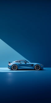 Обои на телефон Голубой спортивный автомобиль Mercedes-AMG GT в профиль на фоне синей стены с диагональной тенью от света